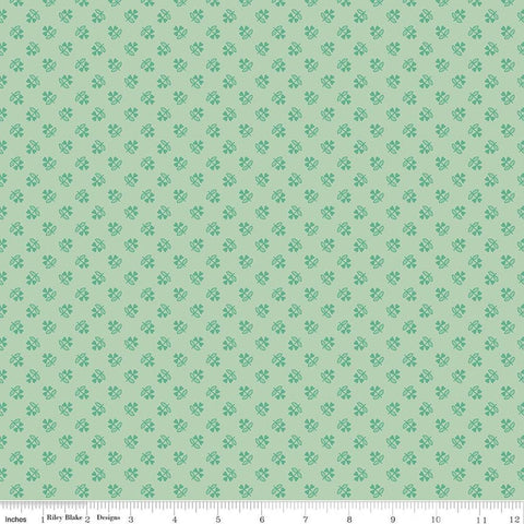 Image of Farmer's Daughter Clover Sage quilting cotton fabric by Lori Holt for Riley Blake Designs. Features plants on a green background. Cute Little Fabric Shop