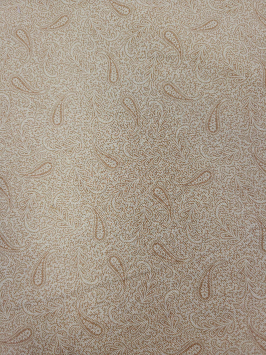 a repeating pattern of paisley designs in various shades of brown and beige.