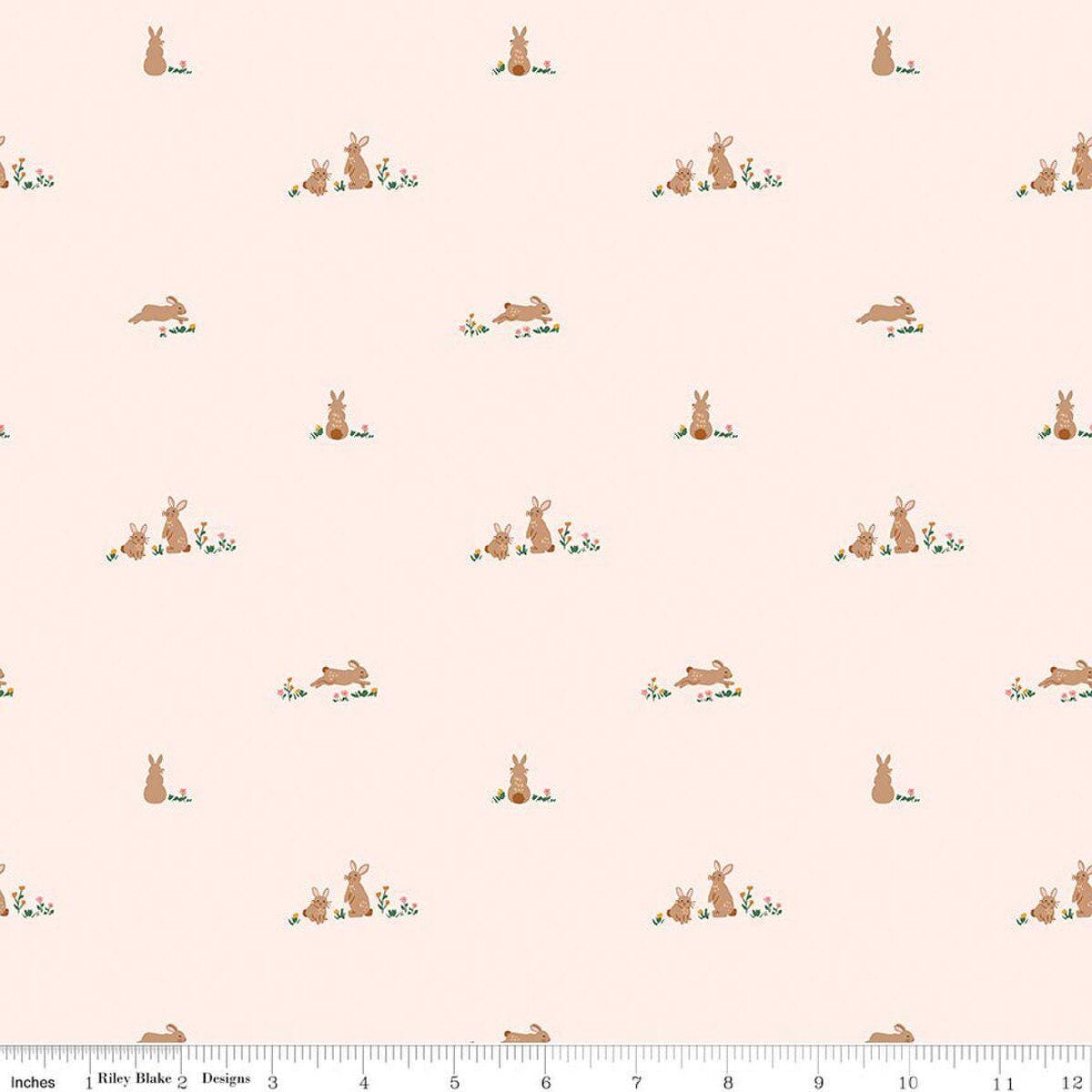 Image of Sweet Cotton Tales Flopsy Fields Blush quilting cotton fabric by Cayla Naylor for Riley Blake Designs. Features rabbits on a cream background. Cute Little Fabric Shop