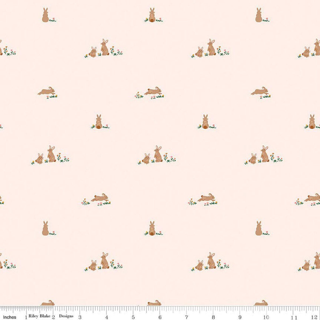 Image of Sweet Cotton Tales Flopsy Fields Blush quilting cotton fabric by Cayla Naylor for Riley Blake Designs. Features rabbits on a cream background. Cute Little Fabric Shop