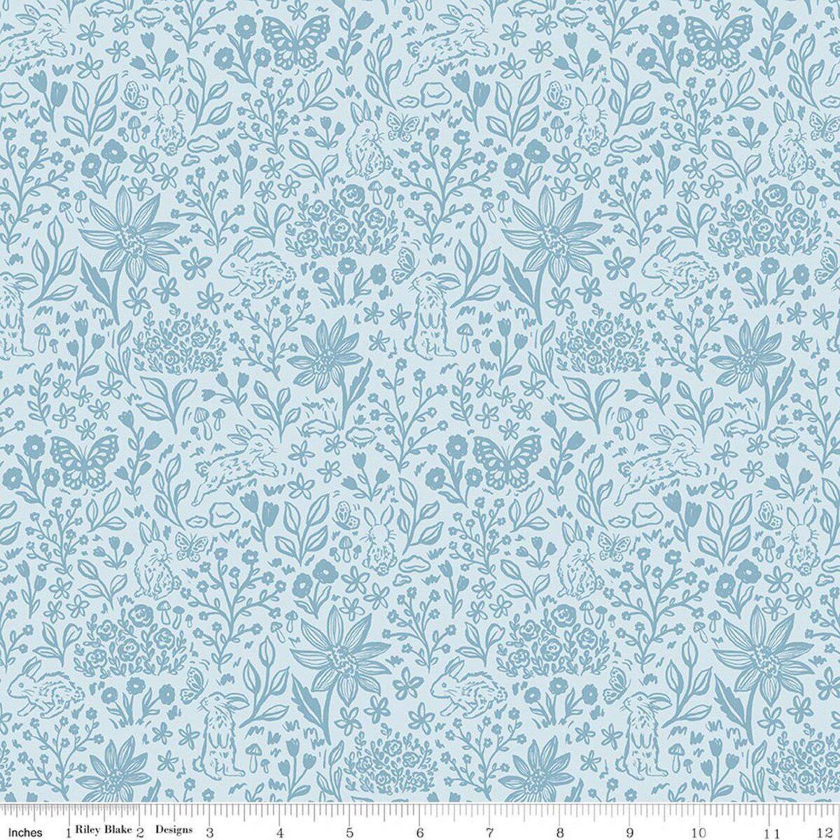 Image of Sweet Cotton Tales Bunny Meadows Powder quilting cotton fabric by Cayla Naylor for Riley Blake Designs. Features plants on a blue background. Cute Little Fabric Shop