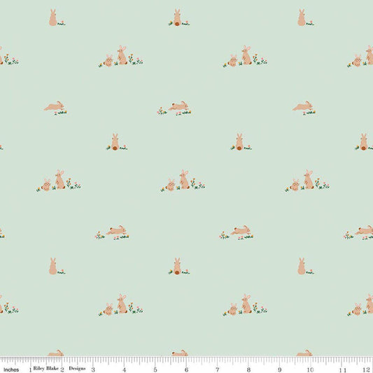 Image of Sweet Cotton Tales Flopsy Field Mint quilting cotton fabric by Cayla Naylor for Riley Blake Designs. Features rabbits on a green background. Cute Little Fabric Shop