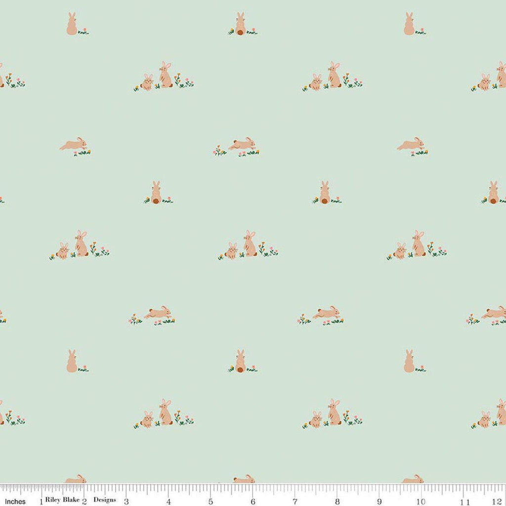 Image of Sweet Cotton Tales Flopsy Field Mint quilting cotton fabric by Cayla Naylor for Riley Blake Designs. Features rabbits on a green background. Cute Little Fabric Shop