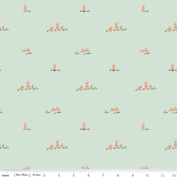 Image of Sweet Cotton Tales Flopsy Field Mint quilting cotton fabric by Cayla Naylor for Riley Blake Designs. Features rabbits on a green background. Cute Little Fabric Shop