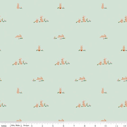 Image of Sweet Cotton Tales Flopsy Field Mint quilting cotton fabric by Cayla Naylor for Riley Blake Designs. Features rabbits on a green background. Cute Little Fabric Shop