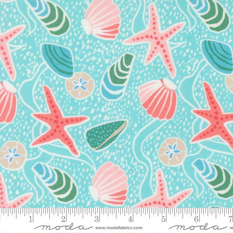 Image of Reef Sea Shells Surf quilting cotton fabric by Kate Spain for Moda Fabrics. Features shells on a blue background. Cute Little Fabric Shop