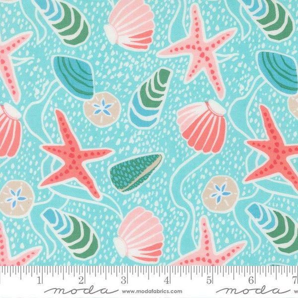 Image of Reef Sea Shells Surf quilting cotton fabric by Kate Spain for Moda Fabrics. Features shells on a blue background. Cute Little Fabric Shop