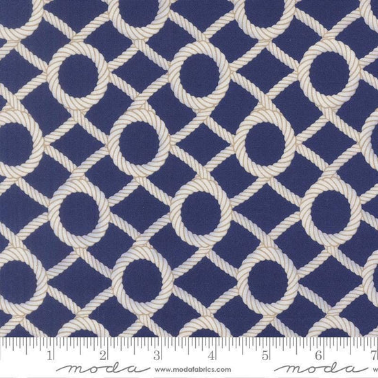 Image of Reef Rope Net Dusk quilting cotton fabric by Kate Spain for Moda Fabrics. Features rope on a blue background. Cute Little Fabric Shop