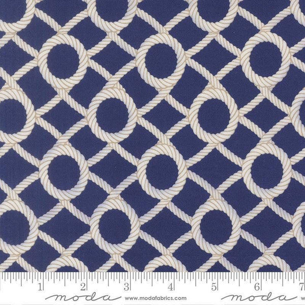 Image of Reef Rope Net Dusk quilting cotton fabric by Kate Spain for Moda Fabrics. Features rope on a blue background. Cute Little Fabric Shop