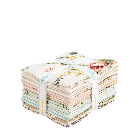 A bundle of colorful fabric swatches tied together with a white ribbon.