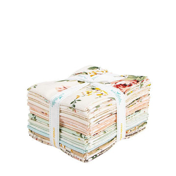 A bundle of colorful fabric swatches tied together with a white ribbon.