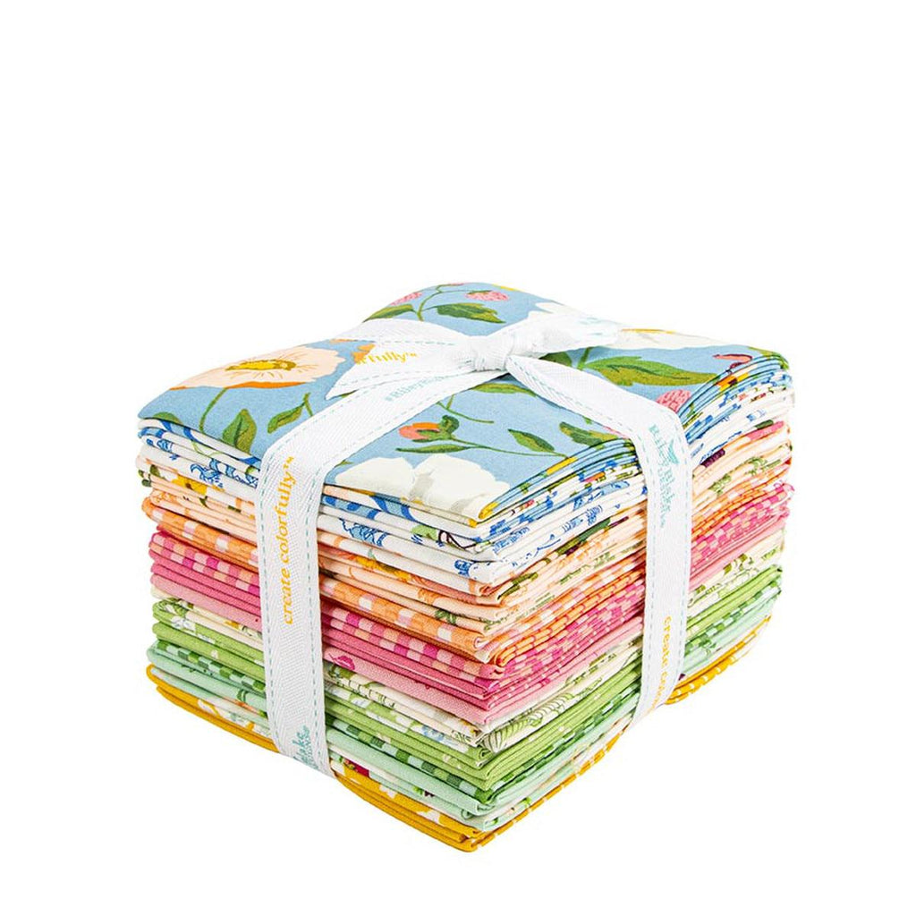 A stack of colorful fabric swatches tied together with a white ribbon.