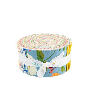 A roll of colorful fabric with a floral pattern and a white ribbon tied around it.