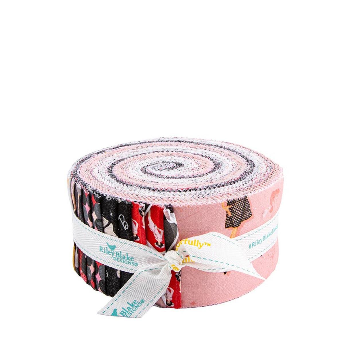 A pink and white spiral-shaped roll of fabric with a white ribbon tied around it.