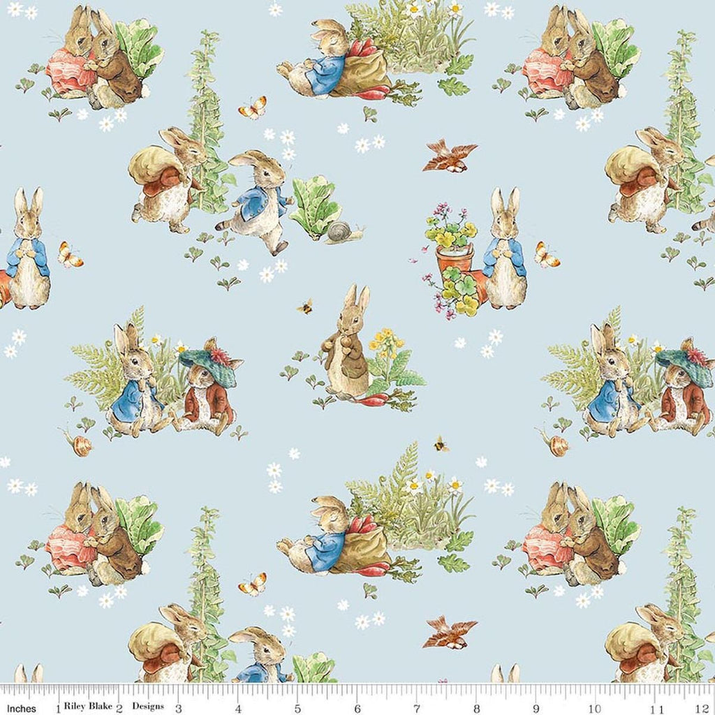 Image of Peter Rabbit and Benjamin Bunny Main Blue licensed quilting cotton fabric by the RBD Designers for Riley Blake Designs. Features rabbits on a blue background. Cute Little Fabric Shop