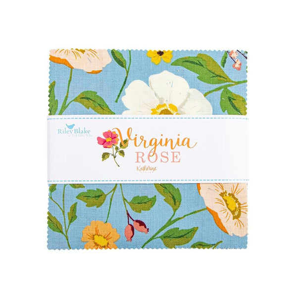 The image is a fabric sample featuring a floral pattern with white and orange flowers, green leaves, and a blue background.