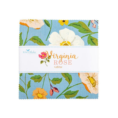 The image is a fabric sample featuring a floral pattern with white and orange flowers, green leaves, and a blue background.