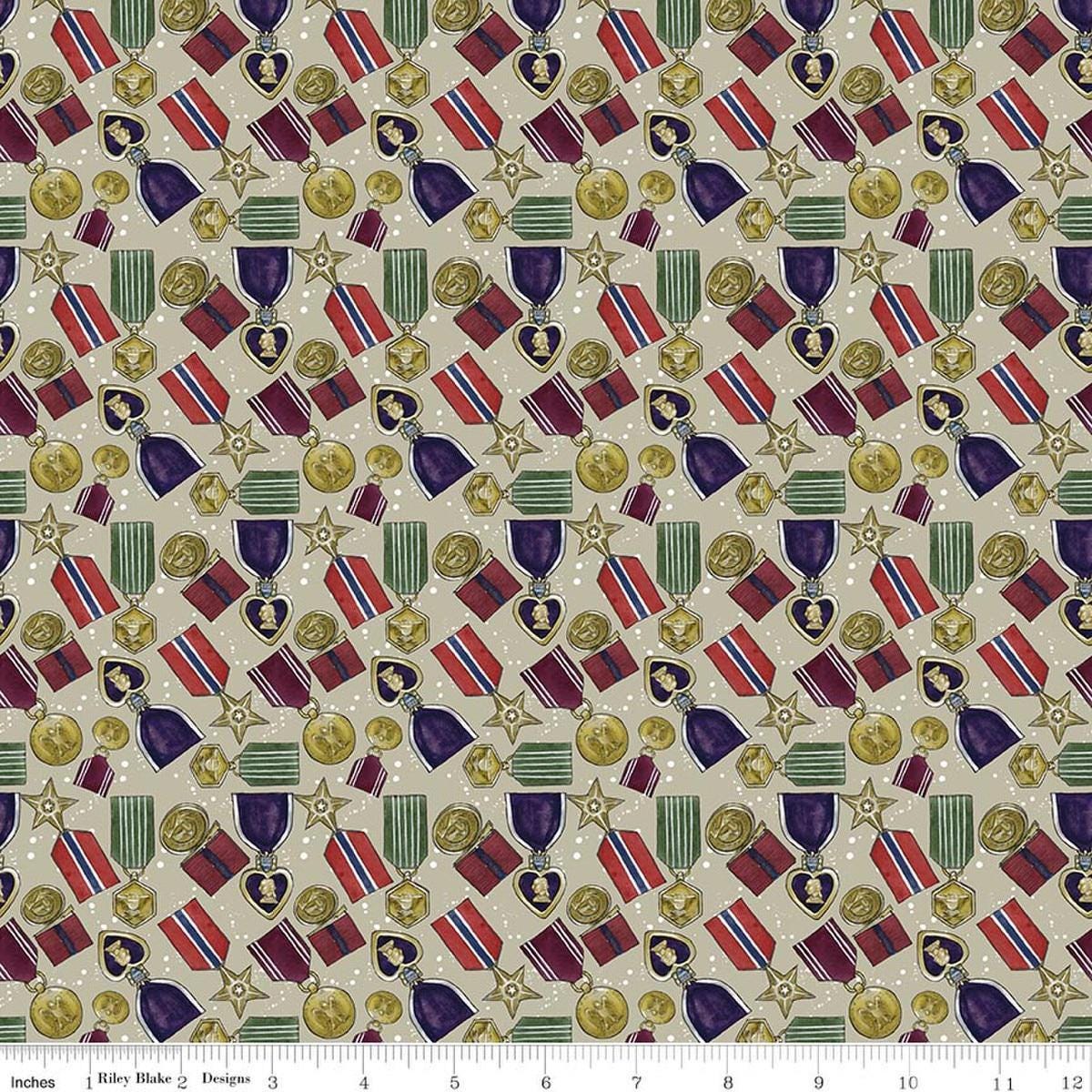 Image of American Honor Medals Khaki quilting cotton fabric by Vicki Gifford for Riley Blake Designs. Features medals on a tan background. Cute Little Fabric Shop