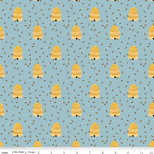 Image of Utah Beehives Blue quilting cotton fabric by Kelsey Carlson for Riley Blake Designs. Features beehives on a blue background. Cute Little Fabric Shop