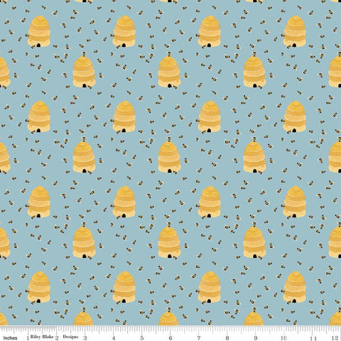 Image of Utah Beehives Blue quilting cotton fabric by Kelsey Carlson for Riley Blake Designs. Features beehives on a blue background. Cute Little Fabric Shop
