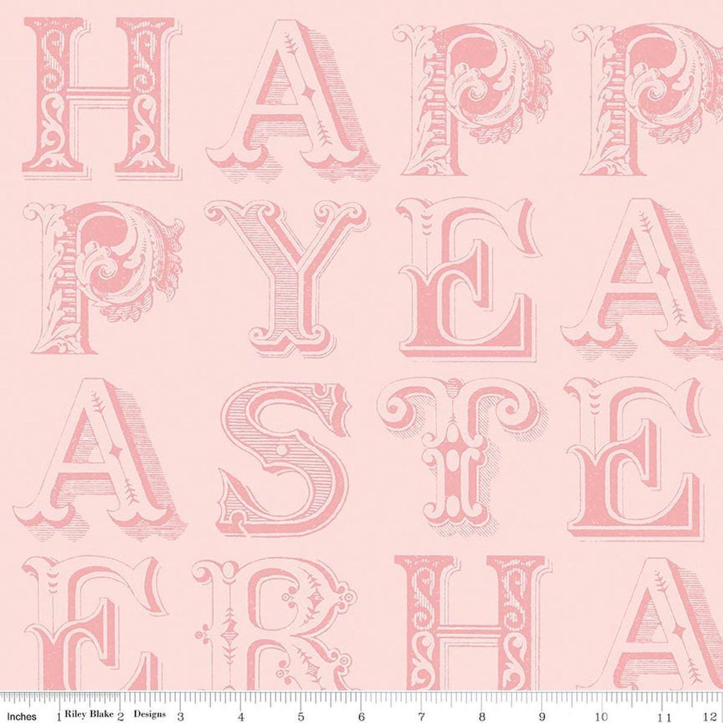 Image of Egg Hunt Happy Easter Blender Pink quilting cotton fabric by J. Wecker Frisch for Riley Blake Designs. Features words on a pink background. Cute Little Fabric Shop.