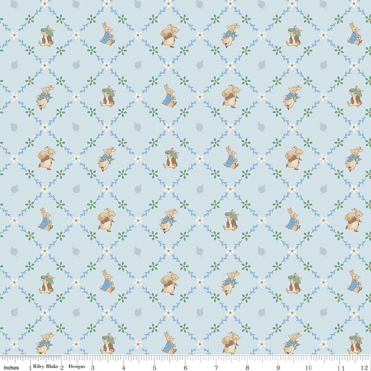 Image of Peter Rabbit and Benjamin Bunny Lattice Blue licensed quilting cotton fabric by the RBD Designers for Riley Blake Designs. Features lattice on a blue background. Cute Little Fabric Shop