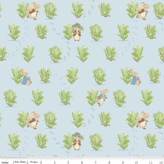 Image of Peter Rabbit and Benjamin Bunny Lettuce Patch Blue licensed quilting cotton fabric by the RBD Designers for Riley Blake Designs. Features lettuce on a blue background. Cute Little Fabric Shop
