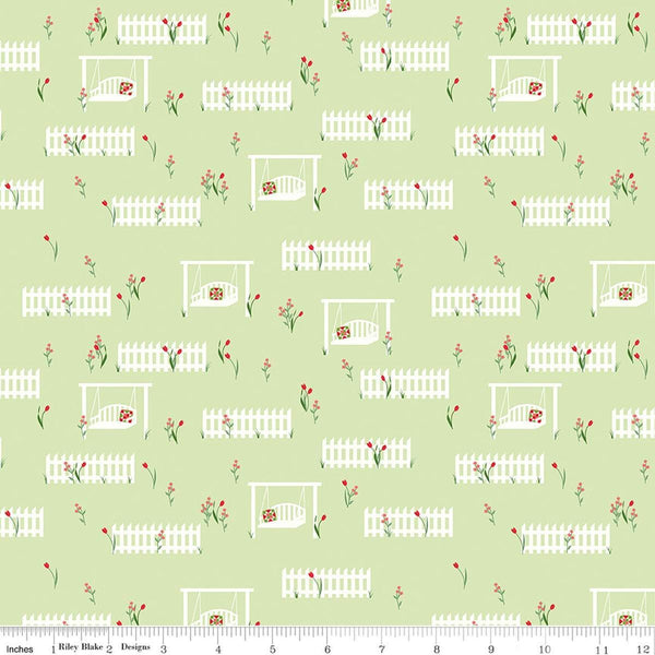 Image of Front Porch Porch Swings Green quilting cotton fabric by Jill Finley for Riley Blake Designs. Features garden fences on a green background. Cute Little Fabric Shop.