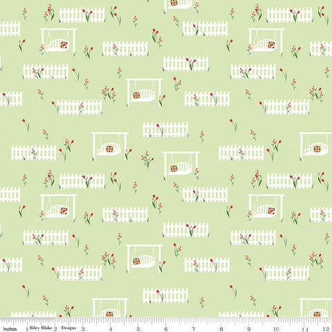 Image of Front Porch Porch Swings Green quilting cotton fabric by Jill Finley for Riley Blake Designs. Features garden fences on a green background. Cute Little Fabric Shop.