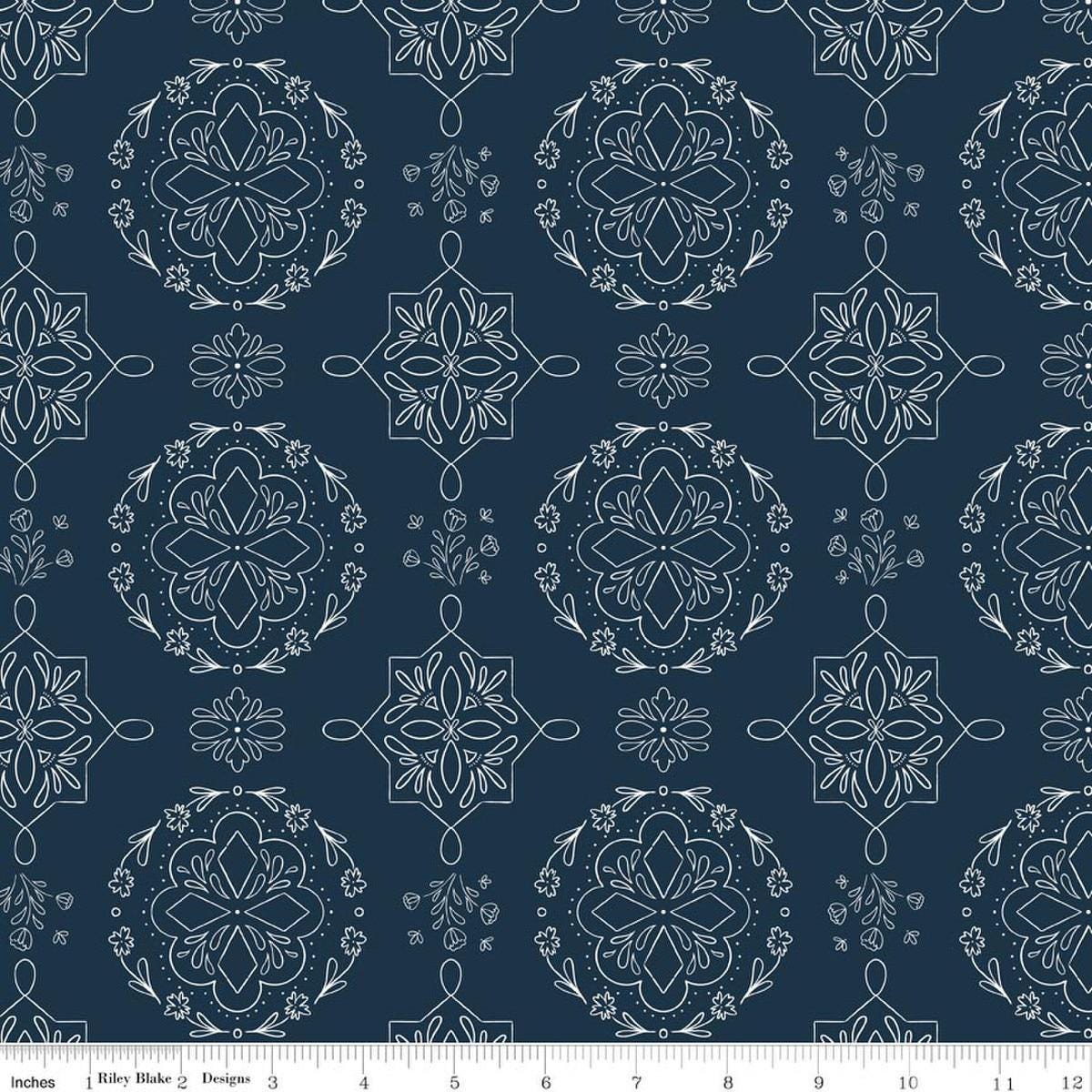 Image of Homage Doilies Oxford Blue quilting cotton fabric by Fran Gulick for Riley Blake Designs. Features printed lace on a dark blue background. Cute Little Fabric Shop.
