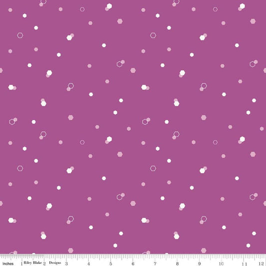 Image of Homage Hexi Fuchsia quilting cotton fabric by Fran Gulick for Riley Blake Designs. Features hexagons on a purple background. Cute Little Fabric Shop.