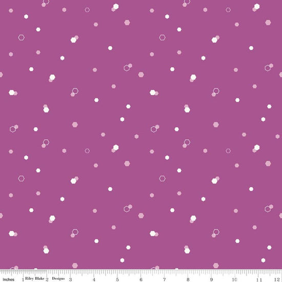 Image of Homage Hexi Fuchsia quilting cotton fabric by Fran Gulick for Riley Blake Designs. Features hexagons on a purple background. Cute Little Fabric Shop.