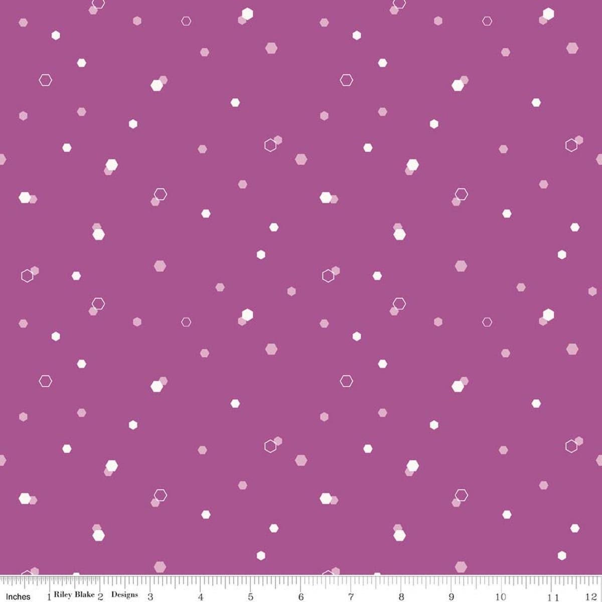 Image of Homage Hexi Fuchsia quilting cotton fabric by Fran Gulick for Riley Blake Designs. Features hexagons on a purple background. Cute Little Fabric Shop.