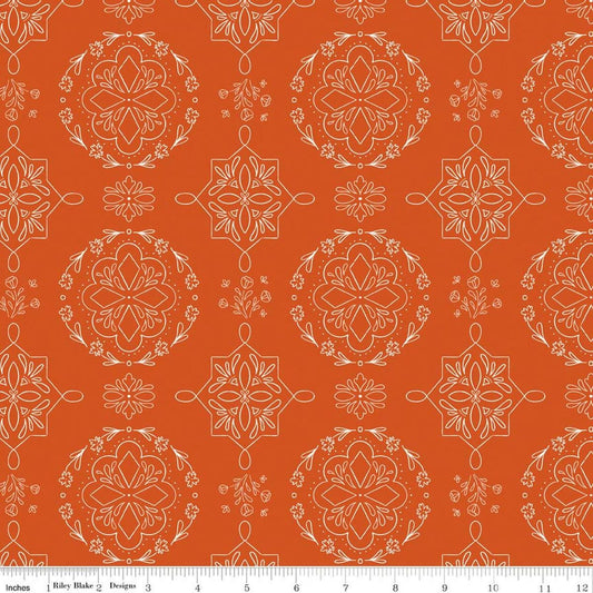 Image of Homage Doilies Pumpkin quilting cotton fabric by Fran Gulick for Riley Blake Designs. Features printed lace on an orange background. Cute Little Fabric Shop.
