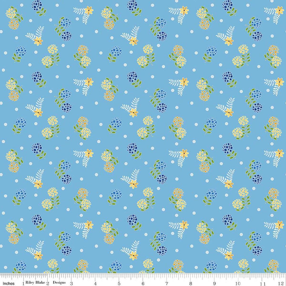 Image of Awakening Blossoms Blue quilting cotton fabric by Cherry Guidry for Riley Blake Designs. Features flowers on a blue background. Cute Little Fabric Shop.