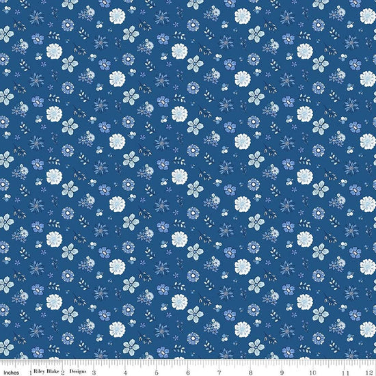 Image of Blue Blooms and Threads Floral Denim quilting cotton fabric by Christopher Thompson for Riley Blake Designs. Features flowers on a blue background. Cute Little Fabric Shop.