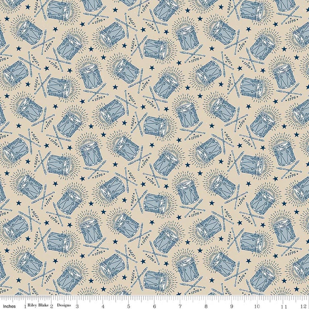Image of Independence Drums Beige quilting cotton fabric by The RBD Designers for Riley Blake Designs. Features drums on a beige background. Cute Little Fabric Shop.