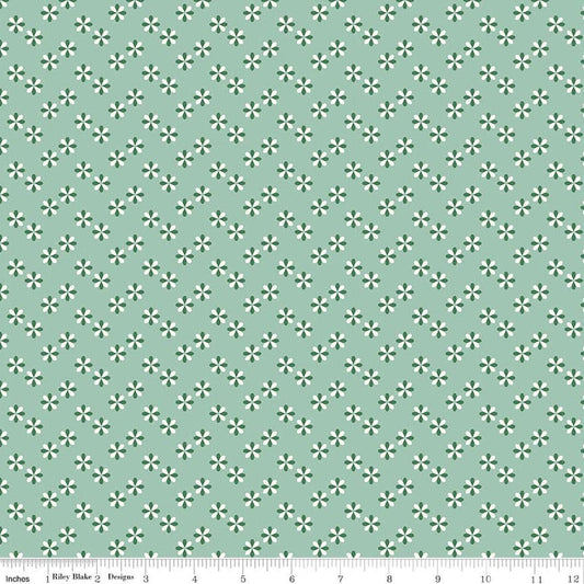 Image of Meadow Moments Flower Sprinkle Mint quilting cotton pattern by Little Forest Atelier for Riley Blake Designs. Features flowers on a green background. Cute Little Fabric Shop.