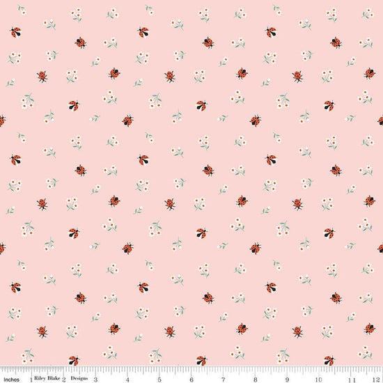 Image of Meadow Moments Ladybugs Pink quilting cotton pattern by Little Forest Atelier for Riley Blake Designs. Features flowers on a pink background. Cute Little Fabric Shop.