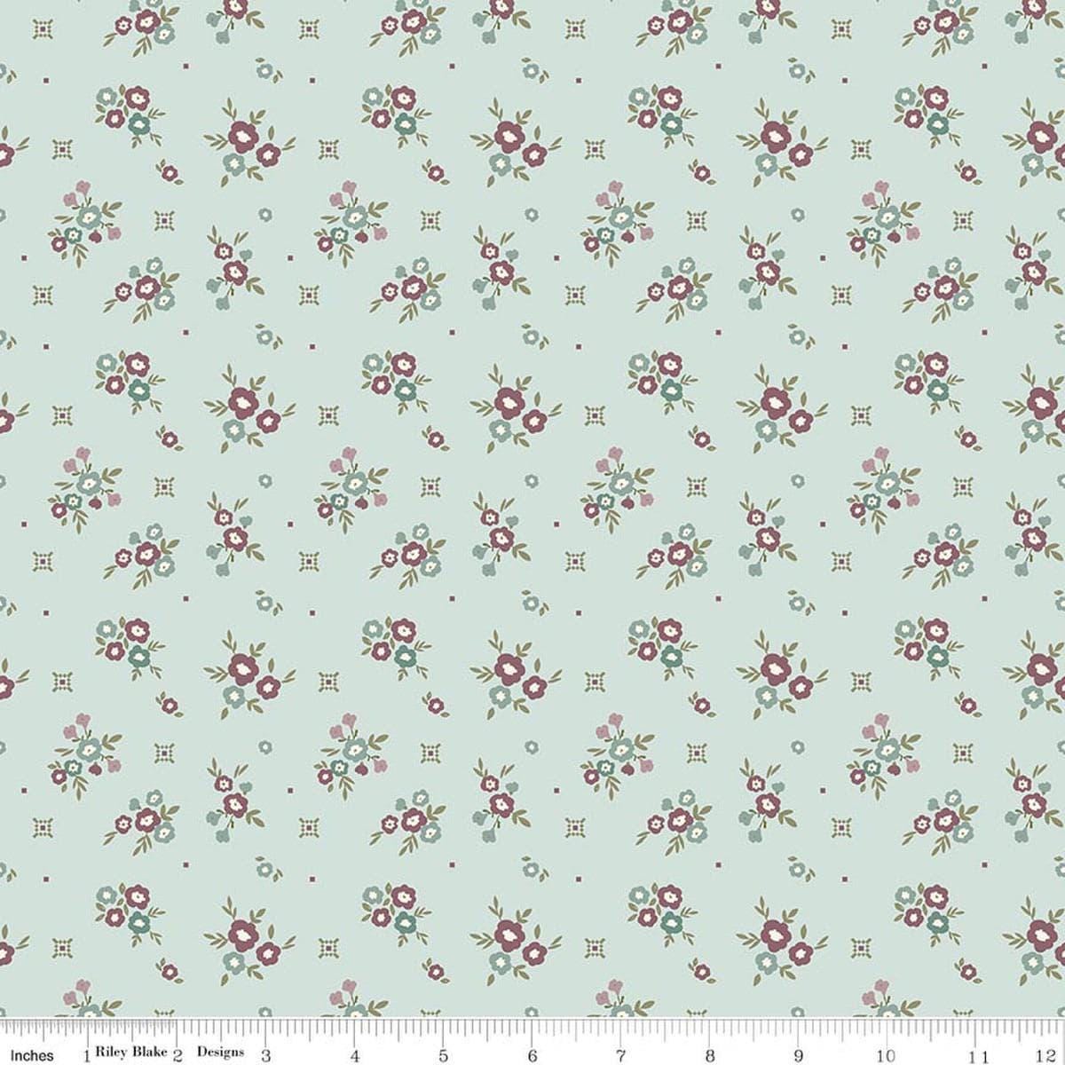 Image of Renew Floral Bleached Denim quilting cotton fabric by Sandy Gervais for Riley Blake Designs. Features flowers on a blue background. Cute Little Fabric Shop.