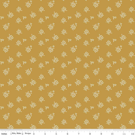 Image of Renew Ditsy Gold quilting cotton fabric by Sandy Gervais for Riley Blake Designs. Features flowers on a yellow background. Cute Little Fabric Shop.