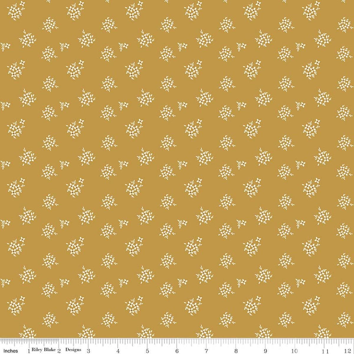 Image of Renew Ditsy Gold quilting cotton fabric by Sandy Gervais for Riley Blake Designs. Features flowers on a yellow background. Cute Little Fabric Shop.
