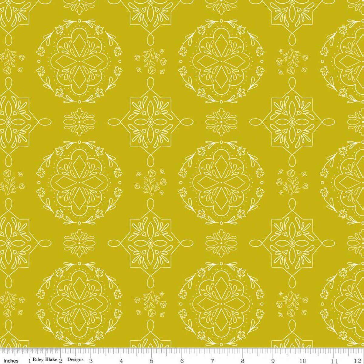 Image of Homage Doilies Citron quilting cotton fabric by Fran Gulick for Riley Blake Designs. Features printed lace on a yellow background. Cute Little Fabric Shop.