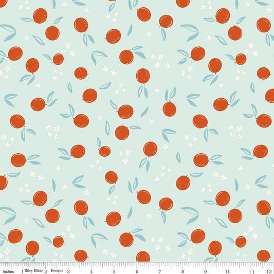 Image of Homage Oranges Washed Denim quilting cotton fabric by Fran Gulick for Riley Blake Designs. Features oranges on a blue background. Cute Little Fabric Shop.
