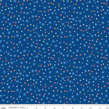 Image of Firecracker Stars Blue quilting cotton fabric by My Mind's Eye for Riley Blake Designs. Features stars on a blue background. Cute Little Fabric Shop.