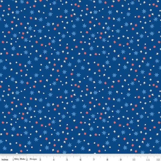 Image of Firecracker Stars Blue quilting cotton fabric by My Mind's Eye for Riley Blake Designs. Features stars on a blue background. Cute Little Fabric Shop.