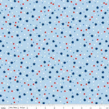 Image of Firecracker Stars Frost quilting cotton fabric by My Mind's Eye for Riley Blake Designs. Features stars on a blue background. Cute Little Fabric Shop.