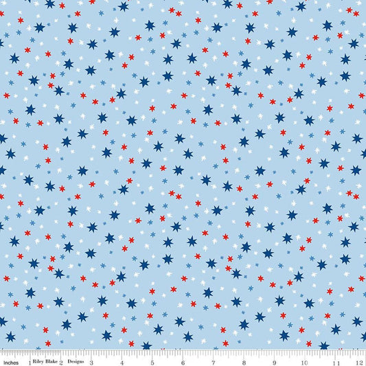 Image of Firecracker Stars Frost quilting cotton fabric by My Mind's Eye for Riley Blake Designs. Features stars on a blue background. Cute Little Fabric Shop.