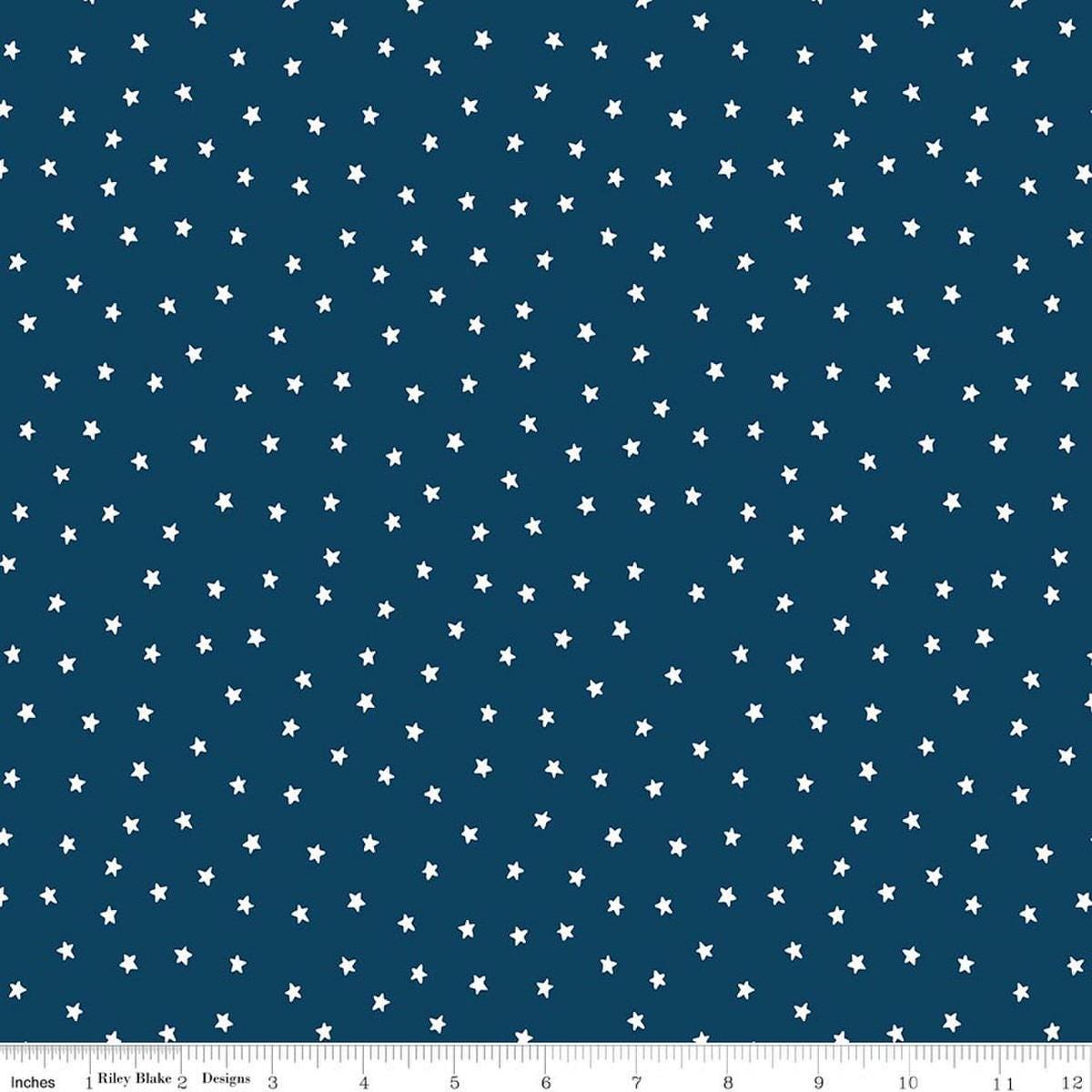 Image of Sew America Star Toss Blue quilting cotton fabric by J. Wecker Frisch for Riley Blake Designs. Features vintage American stars on a blue background. Cute Little Fabric Shop.