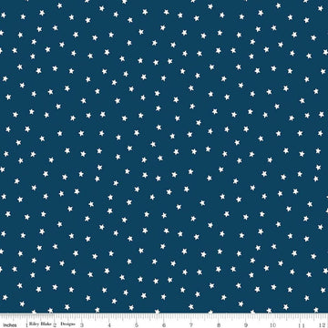 Image of Sew America Star Toss Blue quilting cotton fabric by J. Wecker Frisch for Riley Blake Designs. Features vintage American stars on a blue background. Cute Little Fabric Shop.